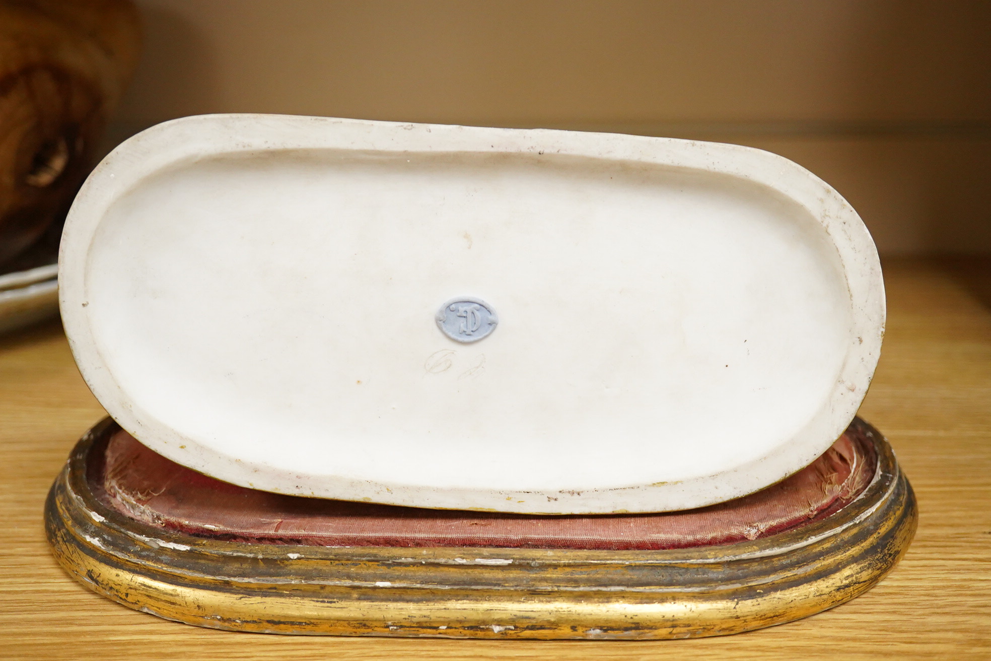 A 19th century biscuit porcelain study of a courting couple under glass dome, raised on gilt base, 28cm high
